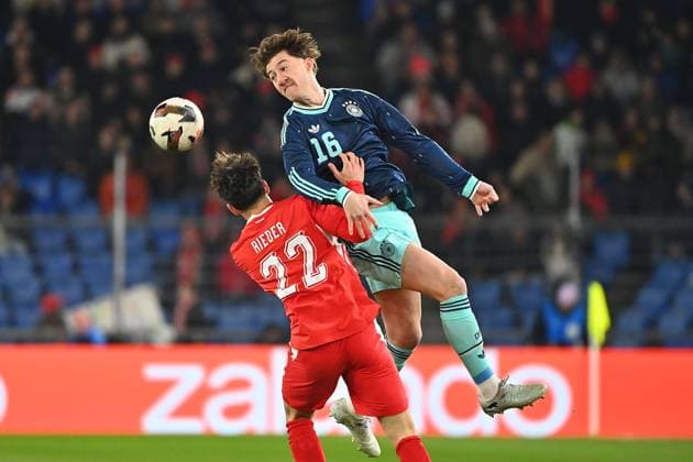 Angelo STILLER (GER), Aktion,Zweikampf gegen Fabian RIEDER (SUI). Fussball Laenderspiel Schweiz -Deutschland 3-4 am 27.03.2026 St. Jakob Park Basel *** Angelo STILLER GER , action,duel against Fabian RIEDER SUI Soccer match Switzerland Germany 3 4 on 27 03 2026 St Jakob Park Basel