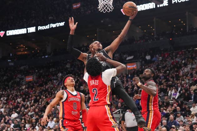 March 27, 2026, Toronto, On, CAN: Toronto Raptors Collin Murray-Boyles (12) shoots on New Orleans Pelicans Herbert Jones (2) during first half NBA, Basketball Herren, USA basketball action in Toronto on Friday, March 27, 2026. Collin Murray-Boyles; Herbert Jones  - ZUMAc35_ 20260327_zaf_c35_185 Copyright: xChrisxYoungx