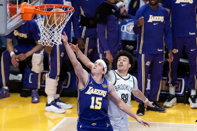 March 27, 2026, Los Angeles, California, USA: Los Angeles LakersÃ¢â‚¬â ¢ Austin Reaves (15) goes to the basket under pressure from Brooklyn NetsÃ¢â‚¬â ¢ Nolan Traore (88) during an NBA, Basketball Herren, USA basketball game at Crypto.com Arena on Friday, March 27, 2026 in Los Angeles. NBA 2026: Nets Vs Lakers  - ZUMAc68_ 20260327_zaf_c68_001 Copyright: xRingoxChiux