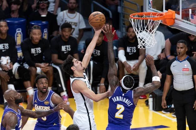 March 27, 2026, Los Angeles, California, USA: Brooklyn NetsÃ¢â‚¬â ¢ Ben Saraf (77) goes to the basket under pressure from Los Angeles LakersÃ¢â‚¬â ¢ Jarred Vanderbilt (2) during an NBA, Basketball Herren, USA basketball game at Crypto.com Arena on Friday, March 27, 2026 in Los Angeles. NBA 2026: Nets Vs Lakers  - ZUMAc68_ 20260327_zaf_c68_022 Copyright: xRingoxChiux