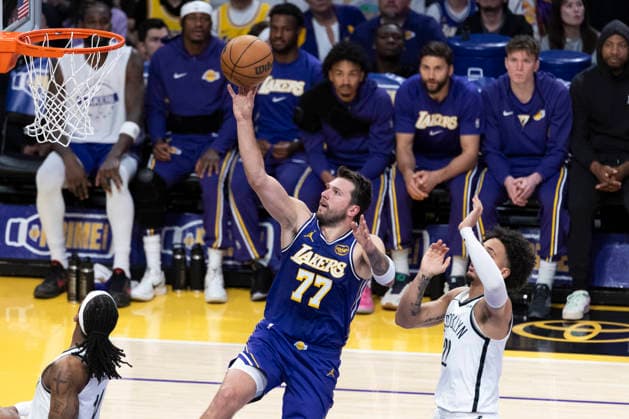March 27, 2026, Los Angeles, California, USA: Los Angeles LakersÃ¢â‚¬â ¢ Luka DonÄÂiÄ¡ (77) goes to the basket against the Brooklyn Nets during an NBA, Basketball Herren, USA basketball game at Crypto.com Arena on Friday, March 27, 2026 in Los Angeles. NBA 2026: Nets Vs Lakers  - ZUMAc68_ 20260327_zaf_c68_024 Copyright: xRingoxChiux