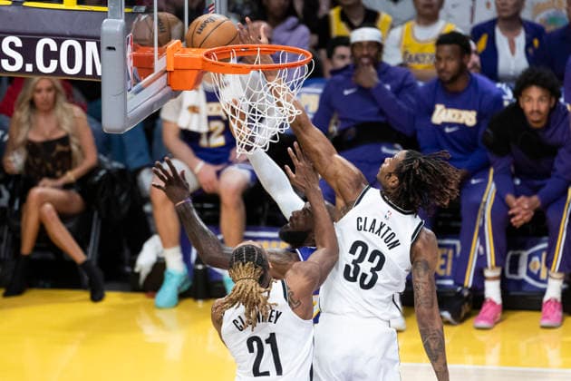 March 27, 2026, Los Angeles, California, USA: Los Angeles LakersÃ¢â‚¬â ¢ LeBron James (23) goes to the basket under pressure from Brooklyn NetsÃ¢â‚¬â ¢ Nic Claxton (33) and Noah Clowney (21) during an NBA, Basketball Herren, USA basketball game at Crypto.com Arena on Friday, March 27, 2026 in Los Angeles. NBA 2026: Nets Vs Lakers  - ZUMAc68_ 20260327_zaf_c68_031 Copyright: xRingoxChiux