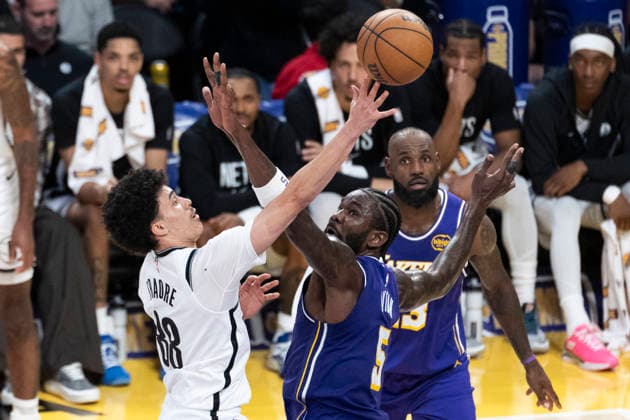 March 27, 2026, Los Angeles, California, USA: Brooklyn NetsÃ¢â‚¬â ¢ Nolan Traore (88) shoots under pressure from Los Angeles LakersÃ¢â‚¬â ¢ Deandre Ayton (5) during an NBA, Basketball Herren, USA basketball game at Crypto.com Arena on Friday, March 27, 2026 in Los Angeles. NBA 2026: Nets Vs Lakers  - ZUMAc68_ 20260327_zaf_c68_033 Copyright: xRingoxChiux