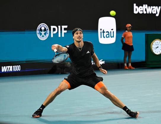 MIAMI GARDENS, FL - MARCH 27: Alexander Zverev of Germany returns a shot to Jannik Sinner of Italy during the men™s semifinal match of the Miami Open on March 27, 2026, at Hard Rock Stadium in Miami Gardens, Florida. (Photo by Michele Eve Sandberg Icon Sportswire) TENNIS: MAR 27 Miami Open EDITORIAL USE ONLY Icon2603270746