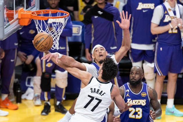 March 27, 2026, Los Angeles, California, USA: Brooklyn NetsÃ¢â‚¬â ¢ Ben Saraf (77) goes to the basket under pressure from Los Angeles LakersÃ¢â‚¬â ¢ Jaxson Hayes (11) during an NBA, Basketball Herren, USA basketball game at Crypto.com Arena on Friday, March 27, 2026 in Los Angeles. NBA 2026: Lakers 116:99 Nets  - ZUMAc68_ 20260327_zaf_c68_049 Copyright: xRingoxChiux