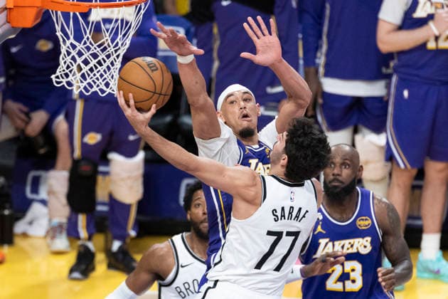 March 27, 2026, Los Angeles, California, USA: Brooklyn NetsÃ¢â‚¬â ¢ Ben Saraf (77) goes to the basket under pressure from Los Angeles LakersÃ¢â‚¬â ¢ Jaxson Hayes (11) during an NBA, Basketball Herren, USA basketball game at Crypto.com Arena on Friday, March 27, 2026 in Los Angeles. NBA 2026: Lakers 116:99 Nets  - ZUMAc68_ 20260327_zaf_c68_053 Copyright: xRingoxChiux