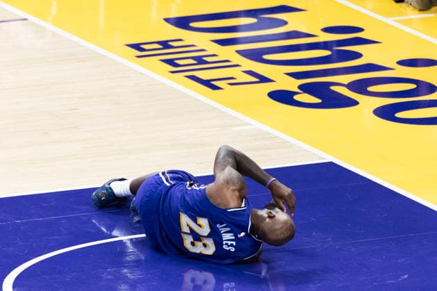 March 27, 2026, Los Angeles, California, USA: Los Angeles LakersÃ¢â‚¬â ¢ LeBron James (23) falls after colliding with Brooklyn NetsÃ¢â‚¬â ¢ Josh Minott (00) during an NBA, Basketball Herren, USA basketball game at Crypto.com Arena on Friday, March 27, 2026 in Los Angeles. NBA 2026: Lakers 116:99 Nets  - ZUMAc68_ 20260327_zaf_c68_056 Copyright: xRingoxChiux