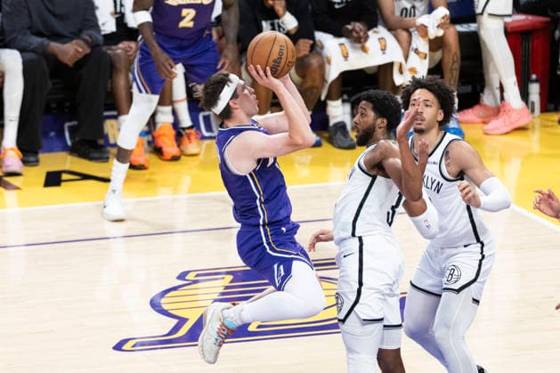 March 27, 2026, Los Angeles, California, USA: Los Angeles LakersÃ¢â‚¬â ¢ Austin Reaves (15) shoots against Brooklyn NetsÃ¢â‚¬â ¢ Chaney Johnson (31) during an NBA, Basketball Herren, USA basketball game at Crypto.com Arena on Friday, March 27, 2026 in Los Angeles. NBA 2026: Lakers 116:99 Nets  - ZUMAc68_ 20260327_zaf_c68_062 Copyright: xRingoxChiux