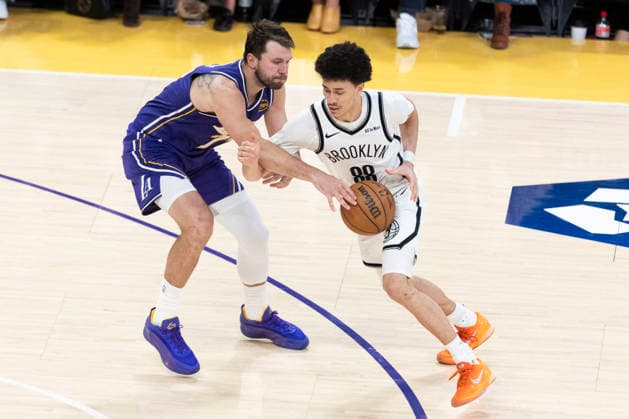 March 27, 2026, Los Angeles, California, USA: Brooklyn NetsÃ¢â‚¬â ¢ Nolan Traore (88) drives against Los Angeles LakersÃ¢â‚¬â ¢ Luka DonÄÂiÄ¡ (77) during an NBA, Basketball Herren, USA basketball game at Crypto.com Arena on Friday, March 27, 2026 in Los Angeles. NBA 2026: Lakers 116:99 Nets  - ZUMAc68_ 20260327_zaf_c68_064 Copyright: xRingoxChiux