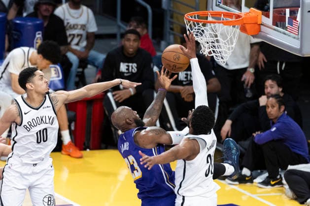 March 27, 2026, Los Angeles, California, USA: Los Angeles LakersÃ¢â‚¬â ¢ LeBron James (23) goes to the basket under pressure from Brooklyn NetsÃ¢â‚¬â ¢ Chaney Johnson (31) during an NBA, Basketball Herren, USA basketball game at Crypto.com Arena on Friday, March 27, 2026 in Los Angeles. NBA 2026: Lakers 116:99 Nets  - ZUMAc68_ 20260327_zaf_c68_067 Copyright: xRingoxChiux