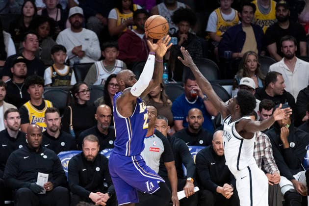 March 27, 2026, Los Angeles, California, USA: Los Angeles LakersÃ¢â‚¬â ¢ LeBron James (23) shoots against Brooklyn NetsÃ¢â‚¬â ¢ Chaney Johnson (31) during an NBA, Basketball Herren, USA basketball game at Crypto.com Arena on Friday, March 27, 2026 in Los Angeles. NBA 2026: Lakers 116:99 Nets  - ZUMAc68_ 20260327_zaf_c68_071 Copyright: xRingoxChiux