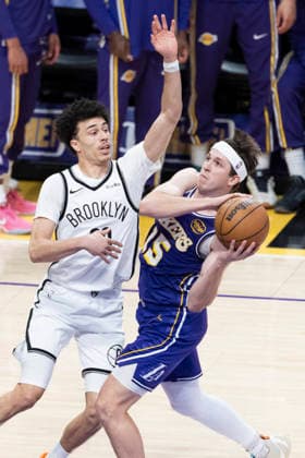 March 27, 2026, Los Angeles, California, United States: Los Angeles Lakers™ Austin Reaves (15) drives against Brooklyn Nets™ Nolan Traore (88) during an NBA, Basketball Herren, USA basketball game at Crypto.com Arena on Friday, March 27, 2026 in Los Angeles. NBA 2026: Lakers 116:99 Nets - 27 Mar 2026  - ZUMAs197 20260327_aaa_s197_548 Copyright: xRingoxChiux