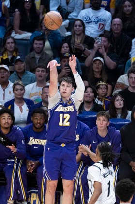 March 27, 2026, Los Angeles, California, United States: Los Angeles Lakers™ Jake LaRavia (12) shoots against Brooklyn Nets™ Ziaire Williams (1) during an NBA, Basketball Herren, USA basketball game at Crypto.com Arena on Friday, March 27, 2026 in Los Angeles. NBA 2026: Lakers 116:99 Nets - 27 Mar 2026  - ZUMAs197 20260327_aaa_s197_551 Copyright: xRingoxChiux