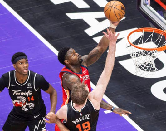 (260328) -- TORONTO, March 28, 2026 -- Zion Williamson (top) of New Orleans Pelicans goes for a layup during the 2025-2026 NBA, Basketball Herren, USA regular season game between Toronto Raptors and New Orleans Pelicans in Toronto, Canada, on March 27, 2026. (Photo by Xinhua) (SP) CANADA-TORONTO-BASKETBALL-NBA-PELICANS VS RAPTORS ZouxZheng 