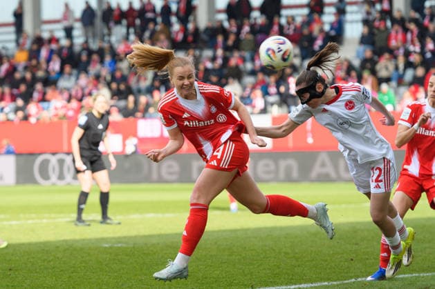 MUNICH, GERMANY - MARCH 28: Glodis Viggosdottir (4 FC Bayern Munich) heading the ball towards the goal next to Julia Pollak (22 1. FC Nuremberg) during the Google Pixel Frauen-Bundesliga match between FC Bayern Munich and 1. FC Nuremberg at FC Bayern Campus Munich, Germany. Copyright: xSvenxBeyrich SPPx Sportspressphoto_SPR119969
