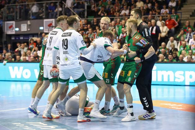 28 03 2026, xtgx, Handball, Daikin HBL, SC Magdeburg Füchse Berlin v l scuffle Max Darj Berlin, 5 , Matthias Musche Magdeburg, 6 Magdeburg