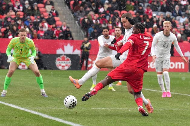 March 28, 2026, Toronto, On, CANADA: Canada s Jonathan David tries to square the ball despite pressure from Iceland s Sverrir Ingi Ingason during International Friendly, Länderspiel, Nationalmannschaft soccer action in Toronto on Saturday March 28, 2026. Jonathan David; Sverrir Ingi Ingason  - ZUMAc35_ 20260328_zaf_c35_046 Copyright: xChrisxYoungx