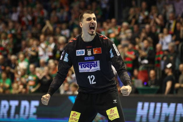 28 03 2026, xtgx, Handball, Daikin HBL, SC Magdeburg Füchse Berlin v l Matej Mandic Magdeburg, 12 cheers over held ball, defended, held, Torhueter Magdeburg