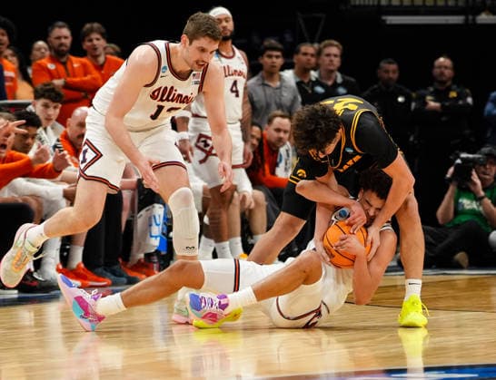 March 28, 2026, Houston, Texas, USA: Iowa guard ISAIA HOWARD (23) and Illinois guard KEATON WAGLER (23) battle for the ball during the NCAA, College League, USA MenÃ¢â‚¬â ¢s Basketball Tournament Elite Eight game between the Illinois Fighting Illini and the Iowa Hawkeyes on March 28, 2026 in Houston, Texas. Illinois won, 71-59. NCAA Basketball 2026: Illinois 71:59 Iowa  - ZUMAc201 20260328_zap_c201_044 Copyright: xScottxColemanx