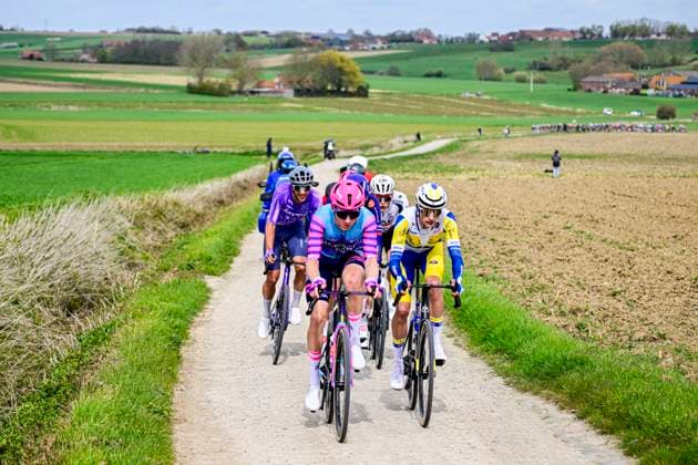 In Flanders Fields From Middelkerke to Wevelgem 2026 Cycling Race WEVELGEM, BELGIUM - MARCH 29 : Rider of Team Unibet Rose Rockets leading the peloton, Rider of Team Flanders - Baloise during the 88th edition of In Flanders Fields From Middelkerke to Wevelgem an UCI World Tour 1.UWT one day cycling road race for Men Elite of 240 km with start in Middelkerke and finish in Wevelgem on March 29, 2026 in Wevelgem, Belgium, 29 03 2026 ( Motordriver Guy De Vuyst - Wevelgem Belgium  Copyright: xJanxDexMeuleneirx