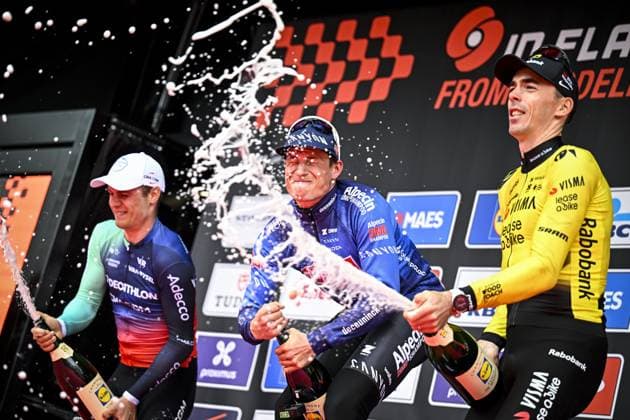 Belgian Jasper Philipsen of Alpecin-Premier Tech celebrates on the podium after winning the men elite Middelkerke-Wevelgem - In Flanders Fields one day cycling race, 240.8 km from Middelkerke to Wevelgem, on Sunday 29 March 2026. JASPERxJACOBS  x169254750x