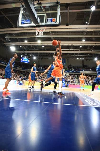 Playing action with Meissa Faye 11 Ratiopharm Ulm during a throw, defended by Osun Osunniyi 12 MLP Academics Heidelberg and Samuell Williamson 10 MLP Academics Heidelberg Playing action with Meissa Faye 11 Ratiopharm Ulm and Osun Osunniyi 12 MLP Academics Heidelberg Copyright: xspeedshotx