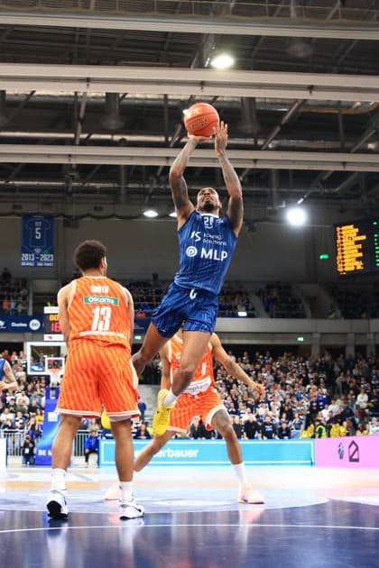 Game action with Osun Osunniyi 12 MLP Academics Heidelberg and Mark Smith 13 Ratiopharm Ulm Osun Osunniyi 12 MLP Academics Heidelberg with throw against Mark Smith 13 Ratiopharm Ulm Copyright: xspeedshotx