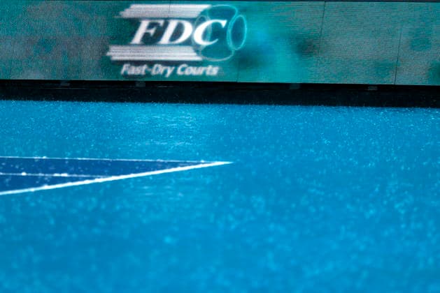 Heavy rain falling on the stadium court during a rain delay before the start of the Jannik Sinner from Italy against Jiri Lehecka from Czechia in the mens final match on the stadium court at the Miami Open in the Hard Rock Stadium in Miami Gardens, Florida, on Sunday, March 29, 2026.  MIA20260329104 GARYxIxROTHSTEIN