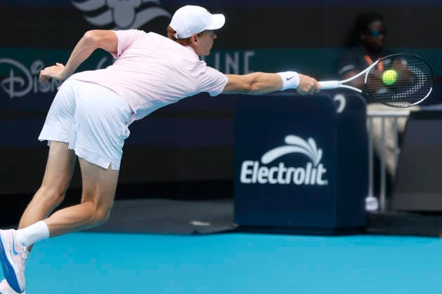 Jannik Sinner from Italy hits a backhand shot to Jiri Lehecka from Czechia in the mens final match on the stadium court at the Miami Open in the Hard Rock Stadium in Miami Gardens, Florida, on Sunday, March 29, 2026.  MIA20260329107 GARYxIxROTHSTEIN