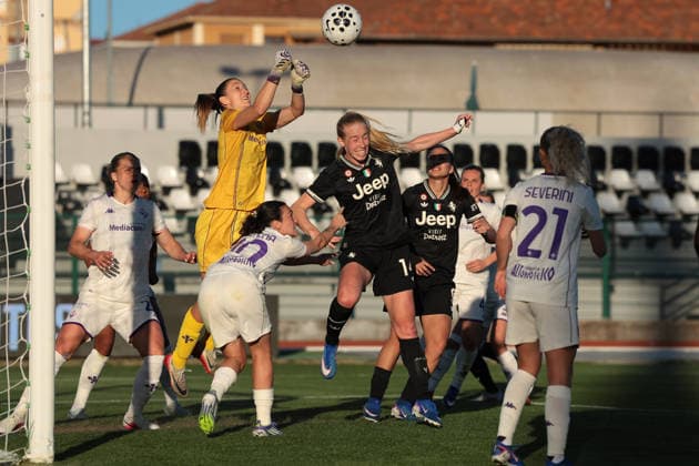 Biella, Italy, 29th March 2026. Cecilie Fiskerstrand of AFC Fiorentina punches clear from Amalie Jorgensen Vangsgaard of Juventus during the Juventus Women vs Fiorentina Women Coppa Italia Femminile Semi Final 2nd leg match at Stadio Vittorio Pozzo, Biella. Picture credit should read: Jonathan Moscrop Sportimage EDITORIAL USE ONLY. No use with unauthorised audio, video, data, fixture lists, club league logos or live services. Online in-match use limited to 120 images, no video emulation. No use in betting, games or single club league player publications. SPI_032_JM_JUVE_FIORENTINA_FEMM_CI SPI-4623-0032