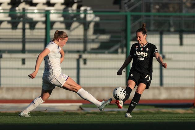 Biella, Italy, 29th March 2026. Hlin Eiriksdottir of AFC Fiorentina challenges Martina Lenzini of Juventus as she clears the ball during the Juventus Women vs Fiorentina Women Coppa Italia Femminile Semi Final 2nd leg match at Stadio Vittorio Pozzo, Biella. Picture credit should read: Jonathan Moscrop Sportimage EDITORIAL USE ONLY. No use with unauthorised audio, video, data, fixture lists, club league logos or live services. Online in-match use limited to 120 images, no video emulation. No use in betting, games or single club league player publications. SPI_034_JM_JUVE_FIORENTINA_FEMM_CI SPI-4623-0034