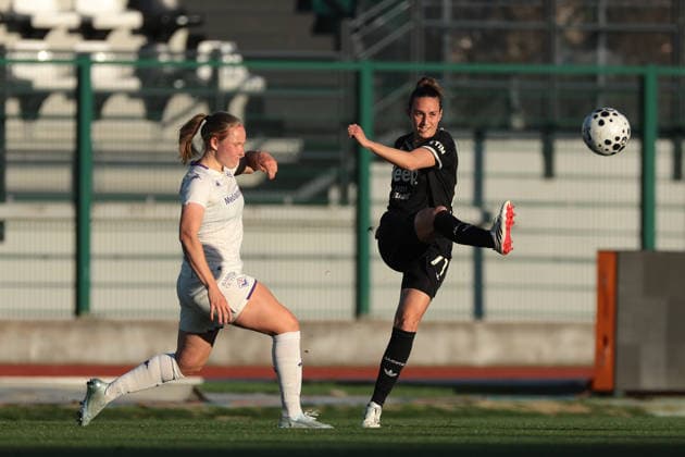 Biella, Italy, 29th March 2026. Hlin Eiriksdottir of AFC Fiorentina challenges Martina Lenzini of Juventus as she clears the ball during the Juventus Women vs Fiorentina Women Coppa Italia Femminile Semi Final 2nd leg match at Stadio Vittorio Pozzo, Biella. Picture credit should read: Jonathan Moscrop Sportimage EDITORIAL USE ONLY. No use with unauthorised audio, video, data, fixture lists, club league logos or live services. Online in-match use limited to 120 images, no video emulation. No use in betting, games or single club league player publications. SPI_035_JM_JUVE_FIORENTINA_FEMM_CI SPI-4623-0035