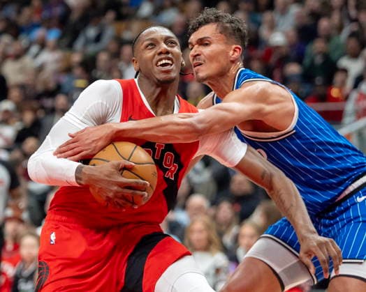 March 29, 2026, Toronto, On, Canada: Toronto Raptors forward RJ Barrett (left) is fouled by Orlando Magic forward Tristan da Silva (23) during first half NBA, Basketball Herren, USA action in Toronto on Sunday, March 29, 2026. Canada News - March 29, 2026  - ZUMAc35_ 20260329_zaf_c35_181 Copyright: xFrankxGunnx