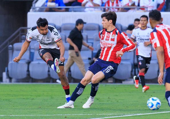 March 29, 2026, Los Angeles, California, USA: Eduardo Aguirre 19 of the Atlas FC kicks past Diego Campillo 19 of the Guadalajara during the Clasico Tapatio game on Sunday March 29, 2026 at the BMO Stadium in Los Angeles, California. Chivas defeat Atlas FC, 1-0. JAVIER ROJAS PI Chivas Defeat Atlas FC, 1-0  - ZUMAp124 20260329_zaa_p124_027 Copyright: xJavierxRojasx