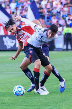 March 29, 2026, Los Angeles, California, USA: Ricardo MaroÂ­n 17 of the Chivas de Guadalajara and VoÂ­ctor RoÂ­os 27 of the Atlas FC struggle for possession the ball during the Clasico Tapatio game on Sunday March 29, 2026 at the BMO Stadium in Los Angeles, California. Chivas defeats Atlas FC, 1-0. ARIANA RUIZ PI Chivas Defeats Atlas FC, 1-0  - ZUMAp124 20260329_zaa_p124_049 Copyright: xArianaxRuizx
