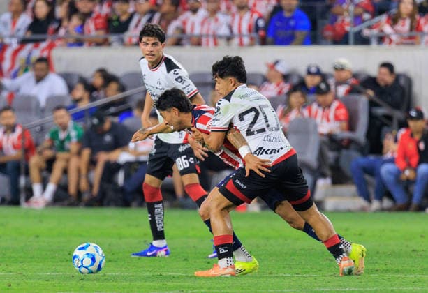 March 29, 2026, Los Angeles, California, USA: JesoÂºs Guillo n 208 of the Atlas FC battles for the ball with Omar Govea 6 of the Chivas de Guadalajara during the Clasico Tapatio game on Sunday March 29, 2026 at the BMO Stadium in Los Angeles, California. Chivas defeat Atlas FC, 1-0. JAVIER ROJAS PI Los Angeles USA - ZUMAp124 20260329_zaa_p124_063 Copyright: xJavierxRojasx