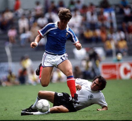 West Germany v France World Cup Mexico 1985=6 Aztec Stadium West Germany v France (0-3) 25 06 1986 Felix Magath (West Germany) tackles Yannick Stoppyra (FRA) Photo Robin Parker International Sports Fotos Mexico Mexico Copyright: xrobinxparkerx