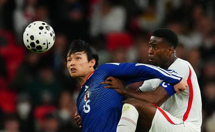 Marc Guehi of England grapples with Ayase Ueda of Japan England v Japan, International Football, Friendly, Football, Wembley Stadium, London, UK - 31 Mar 2026London Wembley Stadium United Kingdom EDITORIAL USE ONLY No use with unauthorised audio, video, data, fixture lists, club league logos or live services. Online in-match use limited to 120 images, no video emulation. No use in betting, games or single club league player publications. Copyright: xJavierxGarcia Shutterstockx 16808984je
