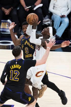 March 31, 2026, Los Angeles, California, USA: Cleveland CavaliersÃ¢â‚¬â ¢ Dennis Schroder (8) drives between Los Angeles LakersÃ¢â‚¬â ¢ Bronny James (9) and Jake LaRavia (12) during an NBA, Basketball Herren, USA basketball game at Crypto.com Arena on Tuesday, March 31, 2026 in Los Angeles. NBA 2026: Cavaliers Vs Lakers  - ZUMAc68_ 20260331_zaf_c68_015 Copyright: xRingoxChiux