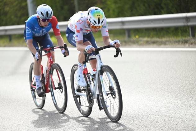 Dwars door Vlaanderen 2026 Cycling Race WAREGEM, BELGIUM - APRIL 01 : Gregoire Romain (FRA) of Groupama - FDJ United, Larsen Niklas (DEN) of Unibet Rose Rockets, Gachignard Thomas (FRA) of TotalEnergies during the 80th edition of Dwars door Vlaanderen an UCI World Tour 1.UWT one day cycling road race for Men Elite of 184 km with start in Roeselare and finish in Waregem on April 1, 2026 in Waregem, Belgium, 01 04 2026 ( Motordriver Kenny Verfaillie - Waregem Belgium  Copyright: xDarioxBelingherix