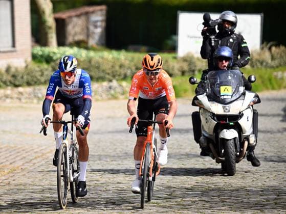 New Zealander Laurence Pithie of Red Bull-BORA-hansgrohe and Italian Filippo Ganna of INEOS Grenadiers pictured in action during the men elite race of the Dwars Door Vlaanderen cycling event, 184,6km from Roeselare to Waregem, Wednesday 01 April 2026. POOLxTOMASxSISK  x169507685x