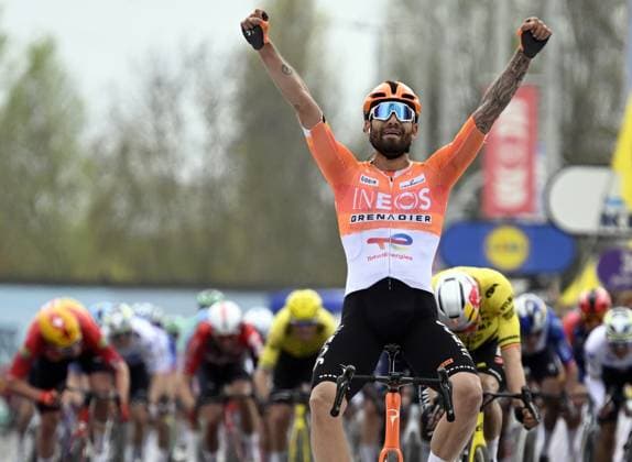 Italian Filippo Ganna of INEOS Grenadiers celebrates after winning the men elite race of the Dwars Door Vlaanderen cycling event, 184,6km from Roeselare to Waregem, Wednesday 01 April 2026. TOM GOYVAERTS TomxGoyvaerts  x169508704x