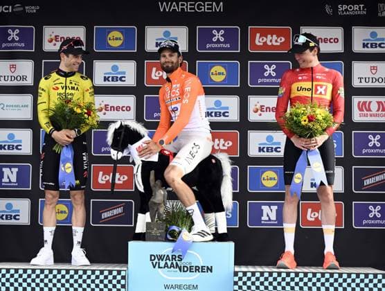 Belgian Wout van Aert, Italian Filippo Ganna of INEOS Grenadiers and Norwegian Soren Waerenskjold celebrate on the podium of the men elite race of the Dwars Door Vlaanderen cycling event, 184,6km from Roeselare to Waregem, Wednesday 01 April 2026. TOM GOYVAERTS TomxGoyvaerts  x169510852x