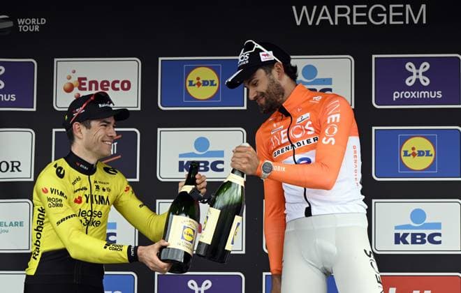 Belgian Wout van Aert of Team Visma-Lease a Bike and Italian Filippo Ganna of INEOS Grenadiers celebrate on the podium with champagne after winning the men elite race of the Dwars Door Vlaanderen cycling event, 184,6km from Roeselare to Waregem, Wednesday 01 April 2026. TOM GOYVAERTS TomxGoyvaerts  x169512141x