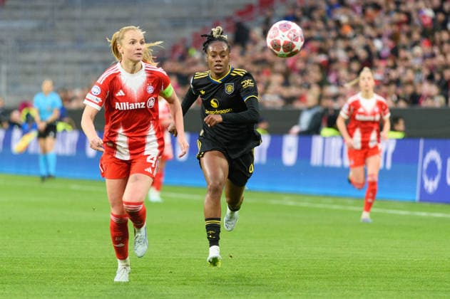 MUNICH, GERMANY - APRIL 1: Glodis Viggosdottir (4 FC Bayern Munich) and Melvine Malard (9 Manchester United, ManU during the UEFA Womens Champions League quarter-final match between FC Bayern Munich and Manchester United at Allianz Arena in Munich, Germany. Copyright: xSvenxBeyrich SPPx Sportspressphoto_SPR122707