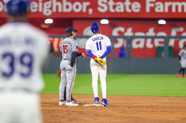 APR 01, 2026: Kansas City Royals third baseman Maikel Garcia (11) and Minnesota Twins second baseman Luke Keaschall (15) watches the replay challenge during a baseball game between the Minnesota Twins and Kansas City Royals at Kauffman Stadium in Kansas City, Missouri. CSM Kansas City United States - ZUMAc04_ 20260402_zma_c04_106 Copyright: xRomanxPunox