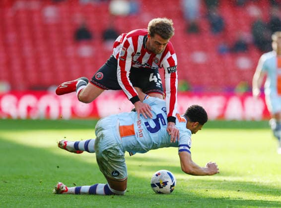 Sheffield, England, 3rd April 2026. Ben Canango of Swansea City fouls Patrick Bamford of Sheffield United during the Sheffield United vs Swansea City Sky Bet Championship match at Bramall Lane, Sheffield. Picture credit should read: Simon Bellis Sportimage EDITORIAL USE ONLY. No use with unauthorised audio, video, data, fixture lists, club league logos or live services. Online in-match use limited to 120 images, no video emulation. No use in betting, games or single club league player publications. SPI_039_SB_Sheff_Utd_Swansea SPI-4660-0018