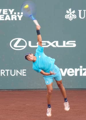 HOUSTON, TX - APRIL 03: Learner Tien (USA) serves the ball during the singles quarterfinals of the Men™s Clay Court Championship on April 3, 2026 at River Oaks Country Club in Houston, Texas. (Photo by Leslie Plaza Johnson Icon Sportswire) TENNIS: APR 03 US Men s Clay Court Championship EDITORIAL USE ONLY Icon260403046