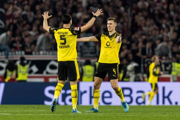 STUTTGART, GERMANY - APRIL 4: Ramy Bensebaini (Borussia Dortmund, 5) and Nico Schlotterbeck (Borussia Dortmund, 4) celebrate the 0:2 goal scored by Julian Brandt (Borussia Dortmund, 10) during the Bundesliga match between VfB Stuttgart vs. Borussia Dortmund at MHP Arena Stuttgart on matchday 28 of the 1. Bundesliga on April 4, 2026 in Stuttgart, Germany. DFL REGULATIONS PROHIBIT ANY USE OF PHOTOGRAPHS AS IMAGE SEQUENCES AND OR QUASI-VIDEO. Baden Wuerttemberg Germany Copyright: xSteffiexWunderlx