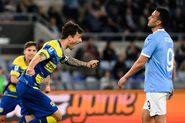 Enrico Delprato of Parma Calcio celebrates in front of Pedro Eliezer Rodriguez Ledesma of SS Lazio after scoring the goal of 0-1 during the Serie A 2025 2026 football match between SS Lazio and Parma Calcio at Stadio Olimpico in Rome (Italy), April 4, 2026. AndreaxStaccioli